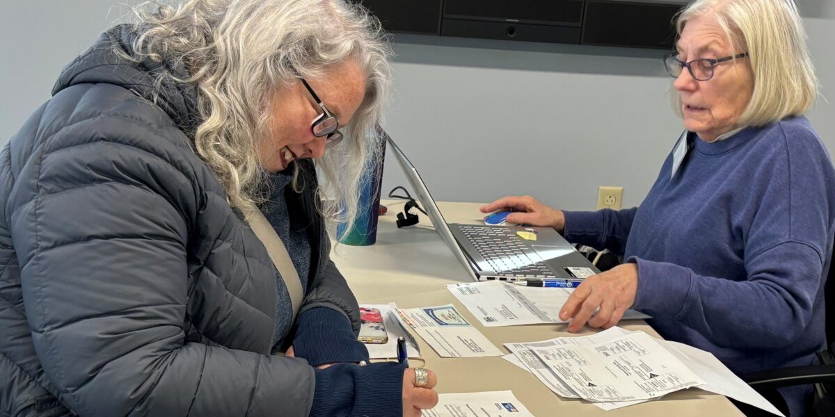 photo of Bowdoinham CA$H volunteer helping prepare taxes for community member