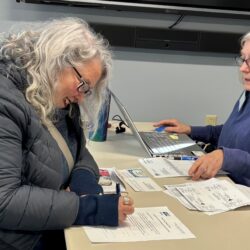 photo of Bowdoinham CA$H volunteer helping prepare taxes for community member